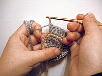 Most crochet uses one hook and works upon one stitch at a time. Crochet may be worked in circular rounds without any specialized tools, as shown here.