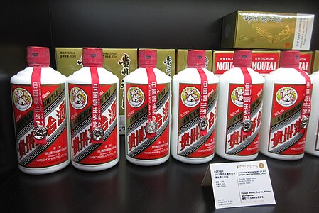 Vintage Maotai in the more common white porcelain bottles displayed in the same auction.