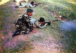 A female soldier of the Rejimen Askar Wataniah with an L1A1 SLR, circa 1990s