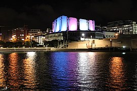 Michael Fowler Centre lit in the colors of the trans flag on 21 March 2018 in remembrance of Zena Campbell.