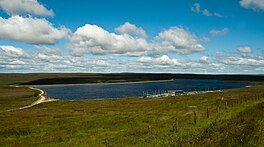 An upland lake surrounded by grass