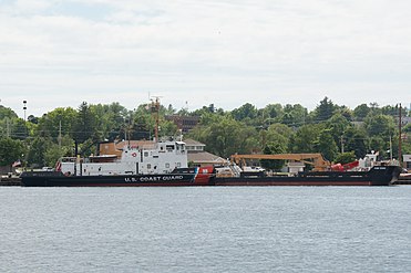 USCGC Mobile Bay, an icebreaking tug based out of Sturgeon Bay,[2] with barge for servicing buoys