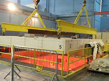 Durasteel ceiling after successful fire test, being raised from the furnace and readied for an optional 45PSI (3.1 bar) hose-stream test.