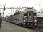 An NJ Transit train of bilevel cars at Millburn Station in 2008