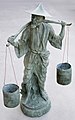 Statue of a water carrier with a pikolan (yoke), China