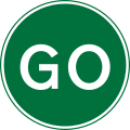 Go ahead or proceed for temporary road works using a hand sign