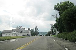 Pompey Center along US 20 westbound; the Pompey town hall is on the left