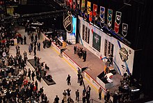 A far away photo of Rakell accepting his jersey