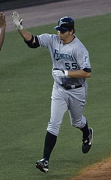 Josh Johnson giving a high-five while walking