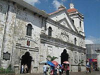 Historical marker attached to the façade of a structure