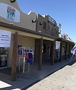 Higley General Store. The community of Higley was named after one of its early landowners, Stephen Weaver Higley, born May 3, 1857. The Higley General Store building was built in 1910, The brown structure pictured in the middle is a remodeled version of the original which still stands near the southwest corner of Higley Road and Williams Field Road and now houses various businesses. The first Post Office was in a back corner of the Higley Store. Listed as historical by the San Tan Historical Society.