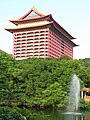 This is the Grand Hotel in Taipei, Taiwan viewed over the tree-line.