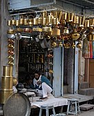 FE8. A brass- and copper-ware shop in Jodhpur. India's retail market accounts for 15 percent of its GDP It is estimated at US$ 450 billion, one of the top five retail markets in the world in economic value.