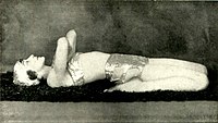 In Supta Virasana, demonstrating "A good exercise for the back and abdominal muscles". Photograph by John de Mirjian, c. 1928