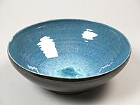 Bowl covered with (external) black, (internal) blue and green running glaze in the center, 1930–60