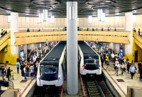 An image of two trains arriving or departing at the Bucharest Metro.