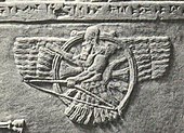 A Neo-Assyrian relief of Ashur as a feather robed archer holding a bow instead of a ring (9th–8th century BC)