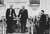 Sergei Prokofiev (on the podium, right) receiving applause after the second performance of his Symphony No. 6.