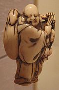 Ivory netsuke depicting Hotei. Japan, 17th century.