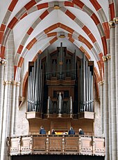 Photo of interior of the church with organ featured prominently