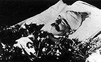 Crown Prince Rudolf placed in a bed for private viewing by his family at the Hofburg palace in Vienna. His head had to be bandaged in order to cover gunshot wounds. When he later lay-in-state, his skull was reconstructed using wax so that his appearance was normal.