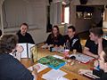 Image 7A group playing a tabletop RPG. The GM is at left using a cardboard screen to hide dice rolls from the players. (from Role-playing game)