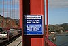 Crisis hotline sign at the Golden Gate Bridge
