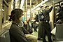 由于H1N1流感大流行疫情，乘坐地铁的墨西哥城市民在途径疫区时佩戴口罩。