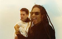 Dan Donovan (left) with fellow Big Audio Dynamite member Don Letts (right) in 1987