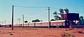 The Ghan in the narrow-gauge diesel-hauled era (pre-1980): the train, headed by an NJ class locomotive, is ready to depart Alice Springs, about 1973
