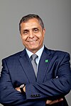 Dr. Mohammad "Mo" Dehghani smiling with his arms crossed facing the camera. He is wearing a suit with a Missouri University of Science and Technology pin and in front of a gray backdrop.