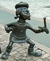 Image 11Statue of Minnie the Minx, a character from The Beano, in Dundee, Scotland. Launched in 1938, The Beano is known for its anarchic humour, with Dennis the Menace appearing on the cover. (from Culture of the United Kingdom)