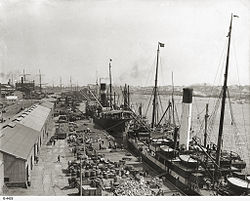Loading cargo onto ships at Queen's Wharf, circa 1927