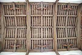 Carved wooden angels decorate the 15th-century tie-beam roof