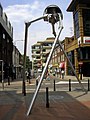 Image 49Statue of a tripod from The War of the Worlds in Woking, England, the hometown of author H. G. Wells. The book is a seminal depiction of a conflict between mankind and an extraterrestrial race. (from Culture of the United Kingdom)