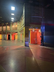 The interior of the Liberty Theatre in 2021. There is a set of multicolored columns along the right side of the image, which support a loggia.