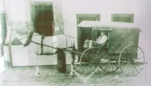 Four-wheeled horse-drawn van of the type available in 1890