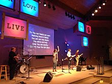 A contemporary worship team leads the congregation in praise and worship