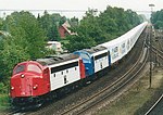 TraXion MY1134 and MY1110 pull a train of Maersk Sealand containers near Vejle, Denmark, in 2001