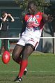 Northwind's All-International ruckman Manny Matata kicking a drop punt