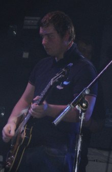 Nicholson performing with Arctic Monkeys in 2006
