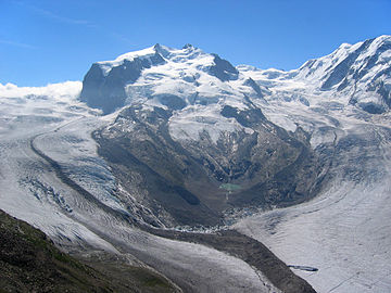 2005: The connection between the Gorner Glacier and Grenzgletscher is still present and the moraine is still fed by the former; the old Monte Rosa Hut (2,795 m) is recognizable above the left over, north-eastern lateral moraine of the Grenzgletscher (in the middle, right).