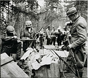 Elderly men being issued rifles to defend their homes from the partisans in Suomussalmi in 1943