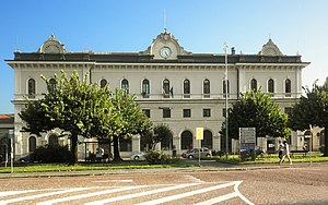 Wide three-story building overlooking parking lot