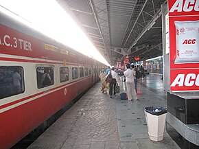 Red-and-white passenger train at the station