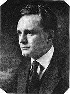 A picture of Frank Borzage. He wears a suit.