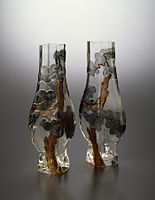 Rousseau-designed pair of pine tree vases (1878–84) Rousseau has adopted the cameo technique found in 18th-century Chinese glass. The Japanese-inspired pine tree designs have been created by cutting away portions of the surface of the glass to reveal the different colours within. Walters Art Museum