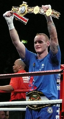 This image depicts the second version of the lonsdale belt, as described in British Board of Boxing Control. It is being aloft by [[George Groves]] after a successful title defence.