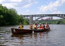 Group paddling a canoe