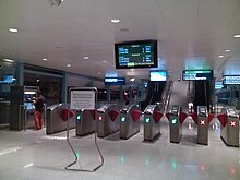 A series of faregates dividing the paid and unpaid areas of the station